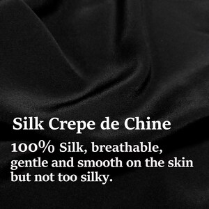May include: Close-up of black silk crepe de chine fabric. The fabric is 100% silk, breathable, gentle and smooth on the skin, but not too silky.