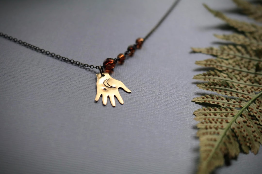 Catching Stars // Hand With Stamped Moon and Star Necklace - Etsy