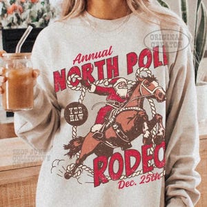 North Pole Rodeo Crewneck UNISX Trendy Country Christmas Sweatshirt Western Christmas Cowboy Santa Claus Shirt Retro PJs Vintage Santa Rodeo
