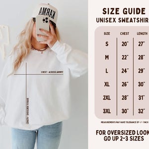 May include: A white unisex sweatshirt size guide featuring a chart with chest and length measurements in inches from S to 3XL. The graphic includes text labels for chest across armpit and length from shoulder to base, noting a 1-inch tolerance.