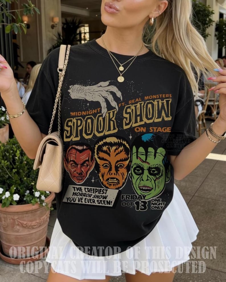 May include: A black t-shirt featuring a graphic print with the text Midnight Spook Show, Ft. Real Monsters, On Stage, The Creepiest Horror Show You've Ever Seen, Friday Oct 13, One Night Only. The design includes a claw and three monster faces.
