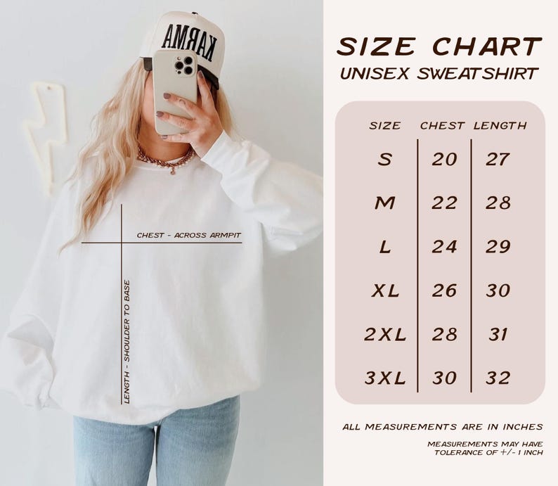 May include: White unisex sweatshirt with a size chart. The chart shows chest measurements from 20 to 30 inches and lengths from 27 to 32 inches. The measurements may have a tolerance of +/- 1 inch.