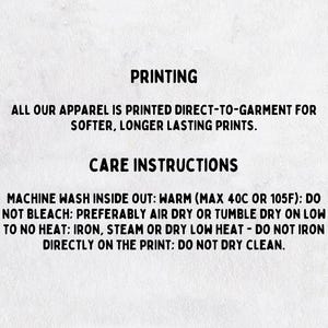 May include: Text on a white background provides printing and care instructions. The text reads: "ALL OUR APPAREL IS PRINTED DIRECT-TO-GARMENT FOR SOFTER, LONGER LASTING PRINTS." Care instructions include machine wash warm, do not bleach, air dry or tumble dry low.