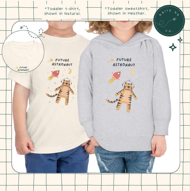 Peut inclure: Deux v&ecirc;tements pour enfants repr&eacute;sentant un tigre portant un casque d'astronaute et une fus&eacute;e. Le t-shirt est de couleur cr&egrave;me avec le texte "FUTURE ASTRONAUT" et le sweat-shirt est gris chin&eacute; avec le m&ecirc;me texte.