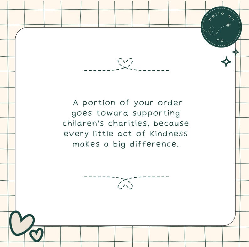 May include: A white card with a green border and text that reads "A portion of your order goes toward supporting children's charities, because every little act of Kindness makes a big difference." The card has a green heart at the top and bottom and a green logo that reads "hello bb co."