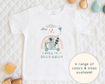 Born To Dilly Dally | Muted Children's T-Shirt Pastel Trash Panda On A Scooter Gift Tee For Kids & Short Sleeve Racoon-Lover Baby Onesie®