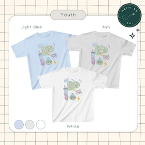 May include: Three youth t-shirts in light blue, ash, and white, each with a "FUTURE SCIENTIST" graphic featuring a beaker, atom, and lightning bolt. The shirts are displayed on a grid background.