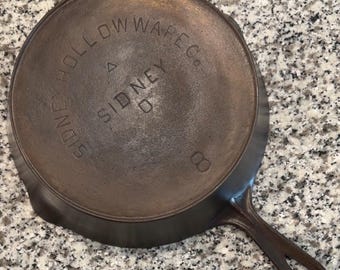 Sidney Holloware Co #8 gietijzeren koekenpan verwarmingsring driehoekje