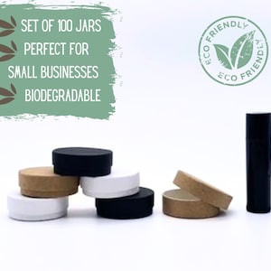 May include: Set of 100 jars, perfect for small businesses.  The jars are biodegradable and come in a variety of colors, including black, white, and brown.  The jars are shown with their lids off, and there is a black tube in the background.  The image also includes a stamp that says "Eco Friendly".