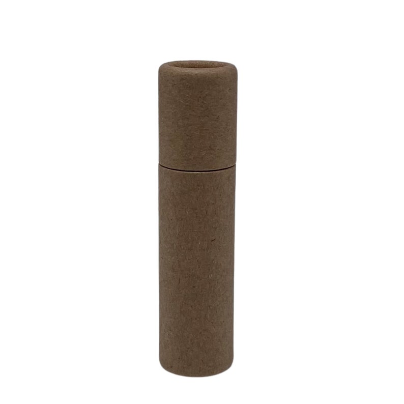 May include: A brown cardboard tube with a round opening at the top. The tube is about 6 inches tall and 1 inch in diameter.