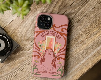 May include: A pink phone case with a retro design featuring a woman's face and the text "ARTSY GIRL ERA ENTERING THE CHAT".