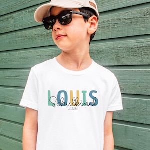 Einschulung T-Shirt 2026 personalisiert mit Name, Schulkind Shirt Mädchen, Tshirt zum Schulstart Junge, Einschulungsshirt Weiß Regenbogen