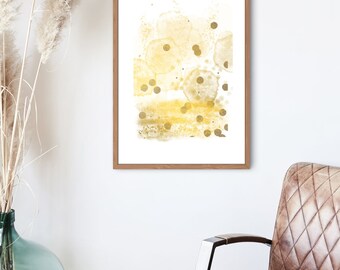 Puede incluir: Impresión de arte abstracto con un diseño de acuarela dorado y blanco. La impresión presenta una serie de círculos y puntos superpuestos en un color dorado claro.