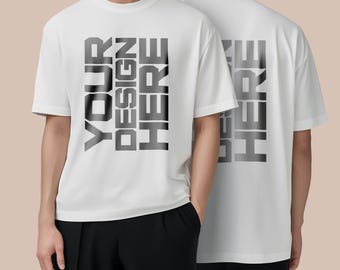 May include: White t-shirt with the text "YOUR DESIGN HERE" printed vertically in a dark grey gradient on the front. The back of the shirt also features the text "DESIGN HERE" in the same style. The model is wearing black trousers.