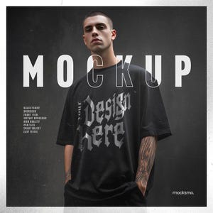 May include: Black oversized t-shirt with the text "Design Here" in a gothic font. The word "MOCKUP" is displayed in large white letters above the shirt. The image also includes text that says "BLACK TSHIRT, OVERSIZED, FRONT VIEW, INSTANT DOWNLOAD, HIGH QUALITY, PSD FILES, SMART OBJECT, EASY TO USE."
