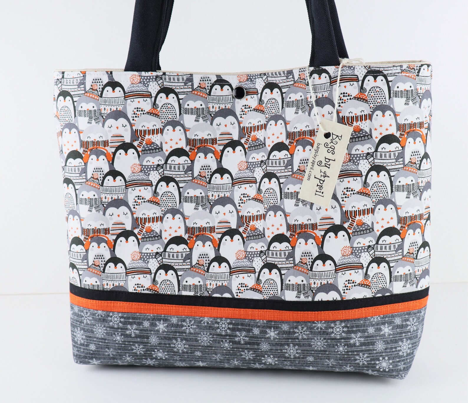 large tote bag with penguin print on the sides