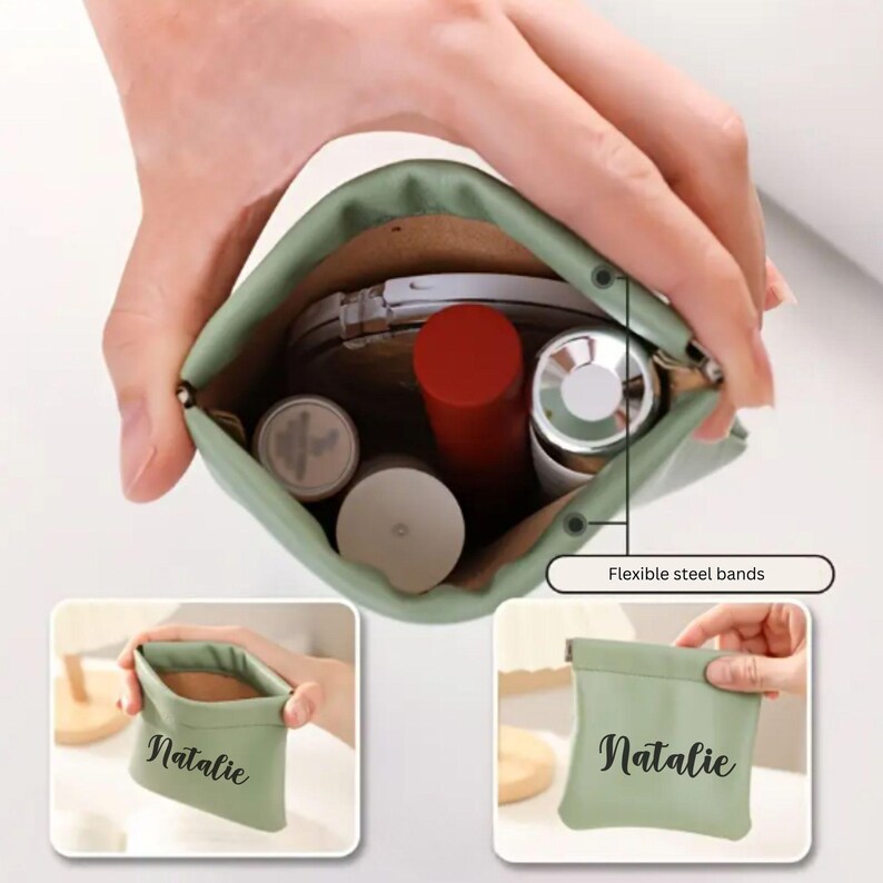 May include: A green zippered pouch with the name "Natalie" printed on it. The pouch is open and shows a variety of items inside, including makeup and a small mirror. The pouch has flexible steel bands on the sides.