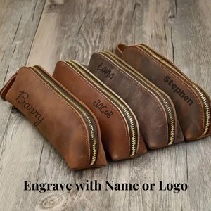 Compact leather travel pouch designed for holding small essentials like a med kit.