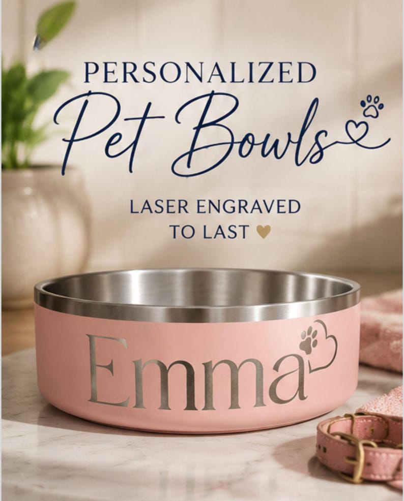 May include: A light pink stainless steel pet bowl with a silver interior. The exterior features the laser-engraved name Emma followed by a heart and paw print icon. Text above the bowl reads PERSONALIZED Pet Bowls and LASER ENGRAVED TO LAST.