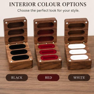 May include: Three open wooden ring boxes with magnetic closures, each featuring three oval slots for rings. The interior velvet lining comes in three distinct color options: black, red, and white. Text reads: INTERIOR COLOUR OPTIONS.