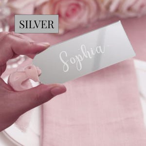 Minimalist wedding name sign made from acrylic resting on a charger plate with neutral-toned decor, ideal for formal events like galas, showers, or weddings as both seating cards and personalized guest favors.