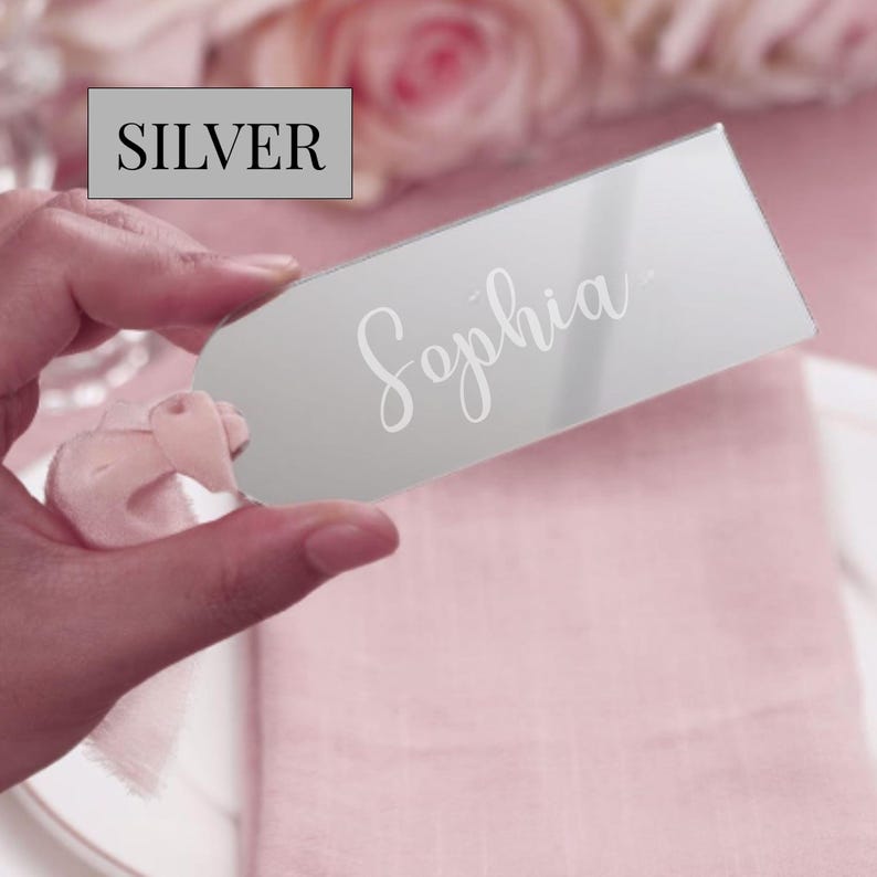 Minimalist wedding name sign made from acrylic resting on a charger plate with neutral-toned decor, ideal for formal events like galas, showers, or weddings as both seating cards and personalized guest favors.