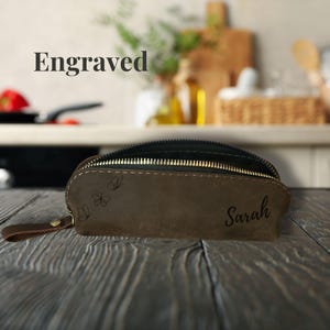Handmade leather makeup brush holder, ideal for travel and everyday use.