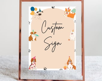 May include: A custom sign with a peach background and a white border. The sign features a variety of cartoon dogs wearing party hats and holding balloons and cupcakes. The text "Custom Sign" is written in black cursive font.