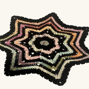 rainbow and black crochet flowstar