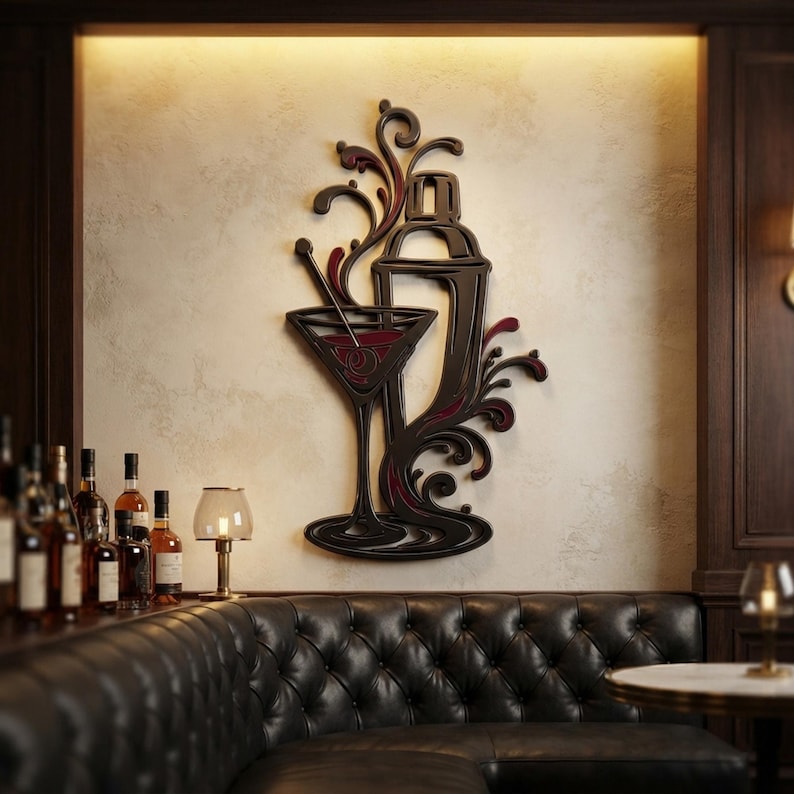 May include: A dark-toned wall art piece featuring a stylized cocktail shaker and a martini glass with swirling, decorative flourishes. The design incorporates deep red accents within the glass and the liquid splashes, creating a layered, dimensional appearance.