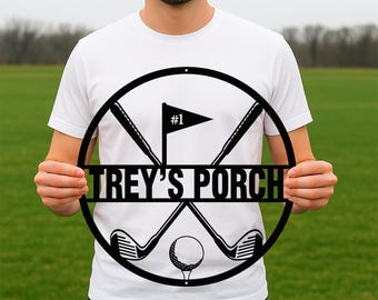 May include: Black metal golf-themed sign with the text "Trey's Porch" and a golf ball and crossed golf clubs. The sign has a white flag with the number "#1" on it.