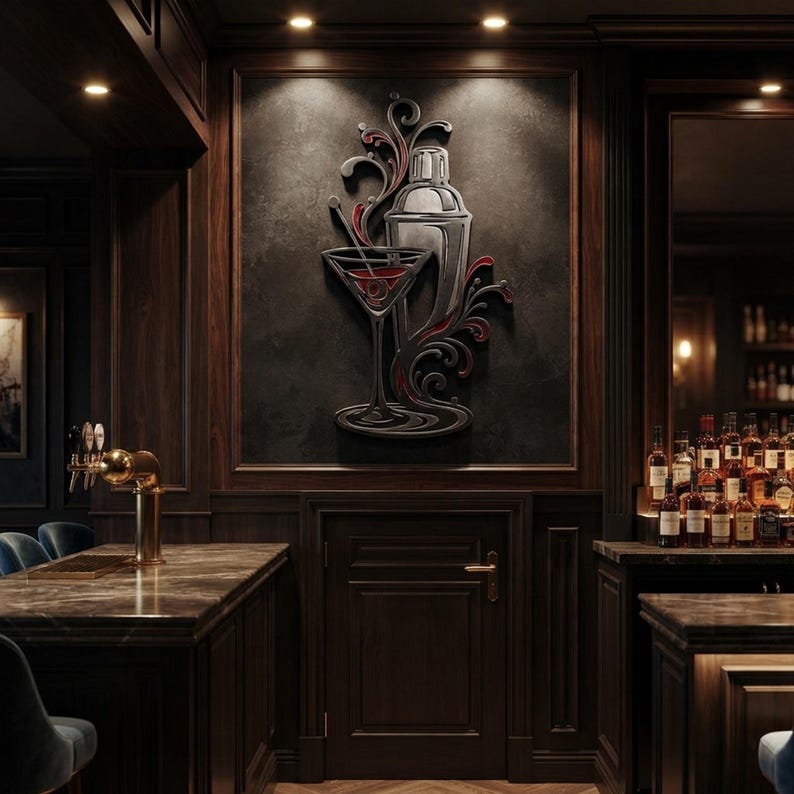 May include: A wall-mounted metal art piece featuring a silver cocktail shaker and a martini glass with red liquid accents, surrounded by stylized black swirling flourishes, displayed on a dark textured panel within a wood-paneled bar setting.