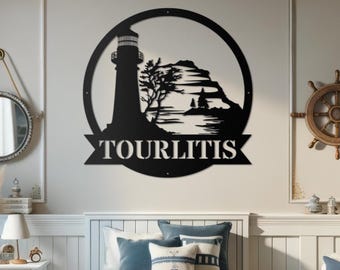 May include: Black metal wall art featuring a lighthouse, a rocky island, and a body of water. The art is in a circle with the name "TOURLITIS" written on a banner below.