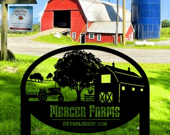 May include: Black metal sign featuring a silhouette of a barn, a tree, and a tractor. The sign reads "Mercer Farms Established 1991".