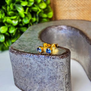 Dainty Sapphire Birthstone Earrings – 4mm Gold-Plated Crystal Studs – Minimalist September Jewelry – Zodiac Cartilage Earrings