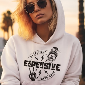 May include: White hoodie with a black skull graphic and the text "Difficult Expensive & Talks Back".