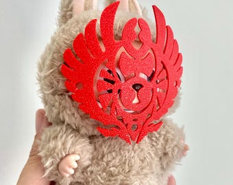 Mini toy sized FFXIV Elidibus ascian mask in red