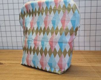 Medium Travel Bag Harlequin Diamond in Light Blue and Pink with a Gold Metallic Accent and a White Speckled Interior Fabric.