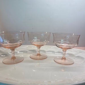 Set of three depression glass champagne glasses