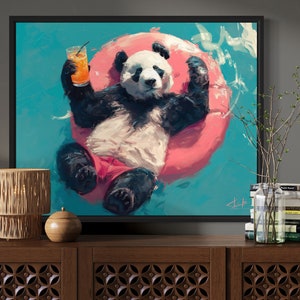 May include: A painting of a panda bear wearing red shorts and floating in a pink inflatable ring in a turquoise pool. The panda is holding a glass of orange juice with a straw.