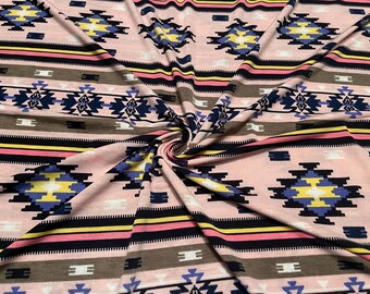 May include: A fabric featuring a repeating geometric pattern in shades of pink, black, yellow, blue, and white. The design includes horizontal stripes and diamond-shaped motifs arranged in a symmetrical layout across the soft, textured material.