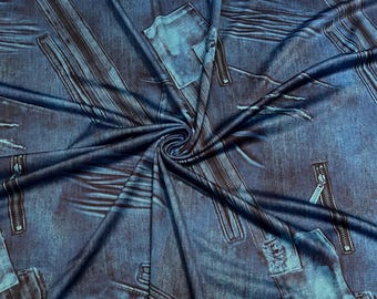 May include: A fabric featuring a printed trompe l'oeil design of blue denim jeans. The pattern includes realistic depictions of metal zippers, stitched pockets, frayed edges, and distressed fabric textures in shades of dark and medium blue.