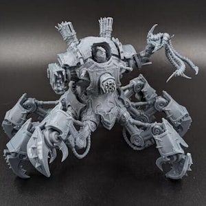 May include: A gray, mechanical war machine with multiple articulated legs and a central body. The model features detailed weaponry, including cannons and claw-like appendages, and is designed with intricate mechanical details.