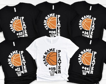 Puede incluir: Cinco camisetas negras y blancas con un diseño de baloncesto. Las camisetas tienen el texto "Team Name Player" con un balón de baloncesto y un gráfico de canasta de baloncesto. Los números en las camisetas son 11, 14, 19, 22 y 44.