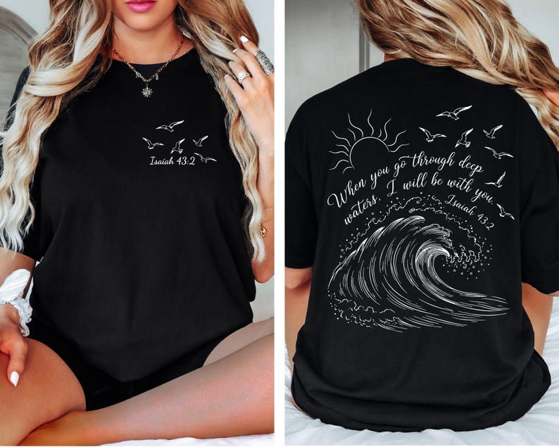 May include: Black t-shirt with white graphic text and illustrations. The front features flying birds and the text "Isaiah 43:2". The back displays a sun, birds, a wave, and the text "When you go through deep waters. I will be with you. Isaiah 43:2".