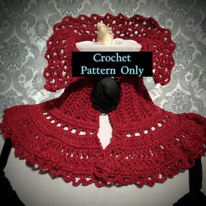 May include: Red crochet collar with a black cameo brooch. Crochet pattern only.