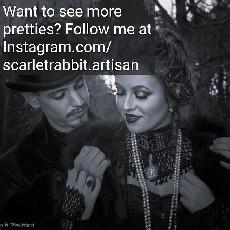 May include: A black and white photograph of a couple in a gothic style. The woman is wearing a black lace top with a pearl necklace and the man is wearing a black suit with a top hat. The text "Want to see more pretties? Follow me at instagram.com/scarletrabbit.artisan" is visible in the image.