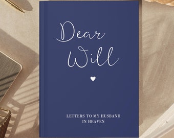 May include: A navy blue journal with the text "Dear Will" in white cursive lettering and a small white heart. The text "Letters to my Husband in Heaven" is printed in white at the bottom of the cover.