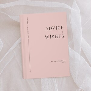May include: A pink book with the text "Advice + Wishes" on the front cover. The book is for future parents and is personalised with the names "Jenna & Thomas" and the year "2024".