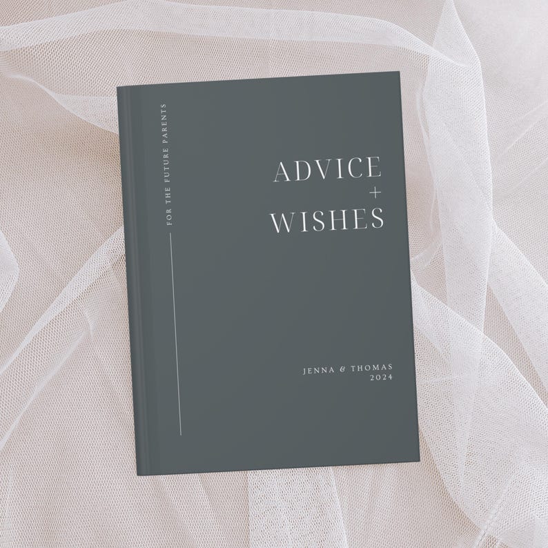 May include: A dark grey hardback journal with the text "Advice + Wishes" in white lettering. The journal is for future parents and has the names "Jenna & Thomas" and the year "2024" printed on the front cover.